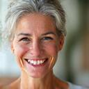 Smiling portrait of Sarah M., 52, a Veridian Bloom community champion.